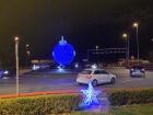 A giant ornament lights up the road