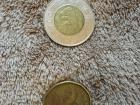 A toonie and a loonie, which are coins worth $2 and $1