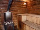 Inside a Russian "banya." To make steam (and increase the temperature inside) you can throw water on the rocks on top of the stove