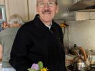 My host dad holding the flowers / herbs he collected from the garden for our tea!