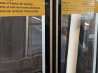 These are the doors of the Funicular, which have writing in Spanish and Catalán to tell the passengers to be careful