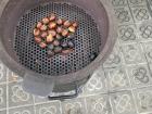 A close up of the chestnuts. You can see how there is a harder outer shell that will eventually peel off once it is charred on the flame