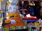 Street vendors sell fruit, vegetables and other items in the city center