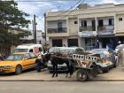 Buses and taxis are not the only way to travel! Horse-drawn carts are everywhere as well. Notice the religious slogan on the side