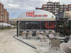 The Albanian flag in the window of a restaurant