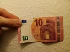 With my thumb for reference, here's a standard 10 Euro Bill! Notice how much smaller it is than the American 10$
