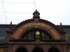 A train station sign in a large city, clearly broadcast for the thousands of travelers it sees every day