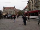 Locals leaving the nearest subway stop as their train departs onward! 