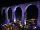 A town and Christmas market hidden away under a bridge on the side of the mountain, like the town in Frozen!