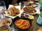 My street food dish: tteokbokki, Korean pancakes, fried tiny crab, and a hot dog. 