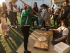 A woman beating rice flour dough for desserts.
