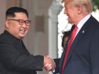 Kim Jong Un shaking hands with Donald Trump.