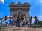 A victory jump in front of the Patuxai Victory Gate