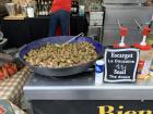 These are escargots being cooked and sold at a food fair