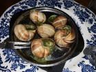 Here is a plate of escargots featuring the "snail fork" for removing the meat
