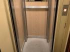 My building's tiny, tiny elevator has barely enough space for two people