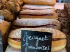 This pâtisserie (pastry shop) displays their raspberry beignets like this