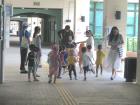 Children at EdUHK wearing animal costumes and handing out pamphlets about saving the environment