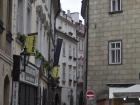 The cobblestone streets located all over Prague with old buildings on each side