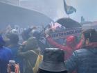 The people of Oviedo celebrating the local soccer team the day of a big game even though it was raining!