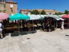 Imagine the noise at the market with people talking prices and amounts; it can get loud at the open air market!