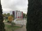 The view outside of my form room window on a cloudy day with the leaves beginning to change