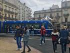 A picture of the Line 1, blue tram at the stop in the city center, or Centre Ville