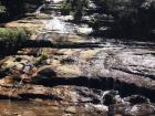 A waterfall in the middle of the mountain