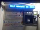 The "Maison de L'eau" is not actually a "maison," it’s a walk up station; you put your money in the machine (about a $1 for 10 liters), and put your container under the spout to be filled