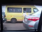 Here is an image of a trotro driving on the highway in Accra. Do you remember what the word "tro" means?