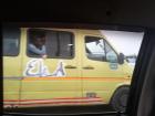 As we ride in an Uber, we see the trotro driver speeding ahead on the highway