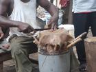 Here is how the animal skin is placed on top of the drum. The man stitching the drum is named Obroni because when he was born, he had blue eyes. Now they're brown!