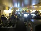 Stations inside SOFIA (left to right): Table, telescope operators, scientists and mission control