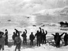 Expedition members on Elephant Island wave goodbye to Ernest Shackleton and team as they set out for South Georgia Island in search of rescue