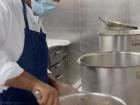 Food preparation in the kitchen, also known as the Galley