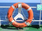 Throwing buoy on one of the top decks of the ship