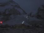 In the very early morning hours from Base Camp on Mount Everest, one can see the lights from headlamps of climbers making their way up through the dangerous Khumbu Icefall