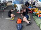 Preparing a boat for launch is a full-team project