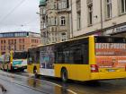 A bus in Dresden chauffeuring people on a rainy day