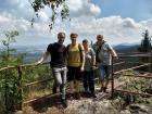 Daniel, his brother, and his parents on a hike