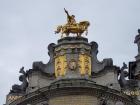 A golden statue atop a building in Brussels' Grand Place Square... one of many such figures!