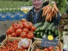An image of a farmer showing his harvested crops