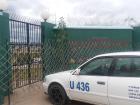 The green gate and a local taxi infront of Neilsa's school