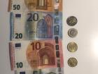 A picture of all the different kind of euros, both bills and coins