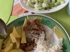 Rice, pork chops, French fries and salad