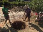 These well diggers are hard at work digging a new well. Wells must be built whenever a new construction project takes place to help collect rainwater and recharge groundwater supplies