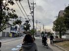 Pedestrians and bike riders sharing the narrow side walk in Hirakata city