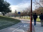 The walkway on the way to University; on the right, everyone walks while on the left, there are lanes dedicated to bikes, scooters and skateboards