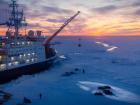 The RV Polarstern offloading equipment onto the sea-ice to start measurements for the MOSAiC expedition (Photo: Stefan Hendricks)
