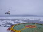A helicopter approaches the helicopter deck aboard the R/V Fedorov (Photo: Pierre Priou)